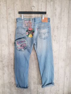 "Ready to send:Size-32,33,34,36,38 unique vintage jeans One of a kind.. Hand made embroidery and unique patches. ---Or---- Made to order, in any size, withim 14 working days . If you need different size, please send me a message and I will make you a special and unique design within 14 working days. They are all different! No one will have the same one as you have! Hand painted, one of kind jeans. You pick your size, model (slim- boyfriend- high waist- low waist) and primer color and you will ge Casual Reworked Jeans For Festival, Light Wash Cotton Jeans For Festival, Festival Straight Leg Denim Jeans, Festival Straight Leg Jeans With Pockets, High Rise Denim Jeans For Festivals, Festival Straight Leg Jeans, Upcycled Straight Leg Denim Jeans, Mid-rise Denim Jeans For Festival, Upcycled Medium Wash Straight Leg Jeans