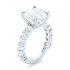 a diamond engagement ring on a white background