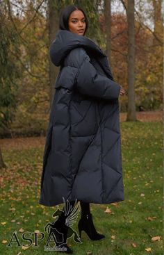 Stay stylish and cozy this winter with our Women's Down Cotton Parkas, a long overcoat designed for comfort and warmth. This thick, hooded coat is perfect for braving the cold while maintaining a fashionable look, making it an essential piece for your winter wardrobe. Crafted from a durable blend of cotton and polyester, this parka features high-quality cotton filling that provides excellent insulation against the chill. The coat is adorned with functional pockets, trendy patch designs, and a se