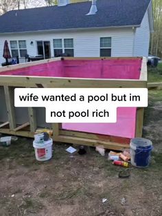 a pink pool is being built in front of a house with the words wife wanted a pool but i'm not pool rich