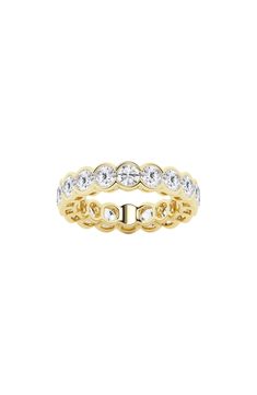 Bezel-set lab-created diamonds illuminate a sparkling eternity band ring crafted from polished 14-karat white, yellow or rose gold. Total lab-created diamond weight: 4.0ct. Color: G+ Clarity: VS–SI 14k white, yellow or rose gold/lab-created diamond Imported Diamond Guide Timeless White Cubic Zirconia Eternity Band, Dazzling White Eternity Band With Brilliant Cut, Dazzling White Brilliant Cut Eternity Band, Dazzling Lab-grown Diamond Eternity Band, White Halo Eternity Band Fine Jewelry, Timeless White Moissanite Eternity Band, Elegant Diamond White Eternity Band With Halo, White Eternity Band With Brilliant Round Cut, White Moissanite Eternity Band In Fine Jewelry