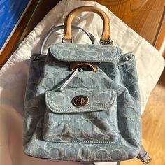 New, Never Worn. Plastic Still On Metal. Dustbag Included. Designer Denim Travel Bag, Blue Denim Bag With Dust Bag Included, Blue Casual Bag With Branded Hardware, Casual Blue Bag With Branded Hardware, Casual Blue Bags With Branded Hardware, Designer Blue Backpack For Daily Use, Designer Blue Backpack For Everyday Use, Casual Coach Backpack, Casual Coach Bags With Leather Handles