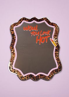 a leopard print mirror with the words would you look hot written on it