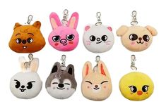 the keychains are decorated with cartoon animals and faces on them, all in different colors