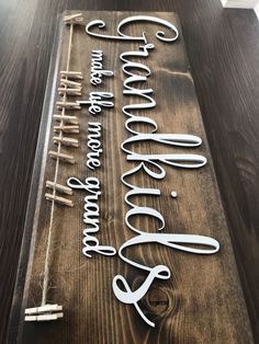 a wooden sign that says welcome to the bride and groom on top of a table