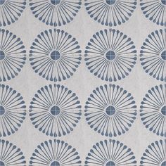 a blue and white wallpaper with an intricate design