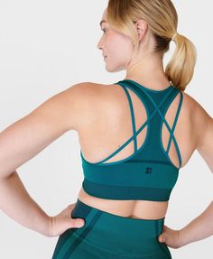 Our feminine new seamless workout bra. Soft, breathable fabric is sweat-wicking with 4-way stretch. Sleek racerback design with modest neckline for extra coverage. Medium support with removable pads. Pair with the matching leggings for a head-to-toe ‘fit. Model wears size S and is 178cm/5'10" tall. Style Code: SB9614Colour: Reef Teal Blue Functional Activewear With Built-in Bra And Seamless Fabric, Nylon Seamless Compression Activewear, Nylon Compression Activewear With Seamless Design, Nylon Sports Bra With Seamless Design For Gym, Seamless Nylon Sports Bra For Gym, Seamless Nylon Activewear For Sports, High Stretch Seamless Nylon Sports Bra, Versatile Seamless Gym Activewear, Versatile Seamless Activewear For Gym