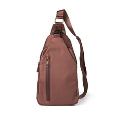 a brown sling bag with straps on the front and shoulder strap, it has a zippered