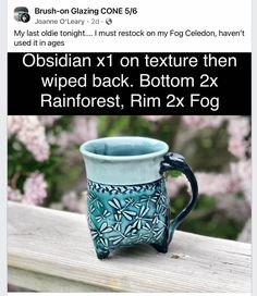 a coffee mug sitting on top of a wooden table