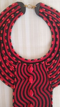 SALE African Choker necklace, Leather choker necklace, Zulu necklace, Beaded necklace, Adjustable necklace, Women jewelry, An authentic elegant necklace that can match with any outfit. 100% handmade Closure: hooks Color: Black and Red. Available in different colors. 3-5 days delivery via DHL Express The shipping fee is for the first item only and additional necklaces or items ship for free.Buy multiple items and pay shipping for 1 item only.The rest ships free.) Wholesale available at a fair pri Bohemian Red Necklace With Black Beads, Traditional Red Necklaces With Black Beads, Traditional Red Necklace With Black Beads, Handmade Red Beaded Choker Necklace, Red Beaded Pendant Necklace, Bohemian Red Bib Necklace With Round Beads, Unique Red Choker As A Gift, Unique Red Choker For Gift, Red Beaded Chain Choker Necklace