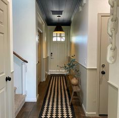 the hallway is clean and ready to be used as a home decorating area for guests