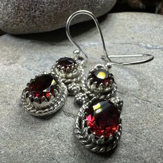 TAKE AN ADDITIONAL 20% OFF THE ALREADY REDUCED SALE PRICE - ADDITIONAL 20% IS DEDUCTED AT CHECKOUT with code SAVE20 Solid Sterling Silver Garnet Dangle Earrings with authentic garnet gemstones. A unique design of deep wine red garnet gemstone adorned with authentic cabochon garnet (4 carat total weight per earring) - an attractive and feminine earring - solid sterling silver. Gemstone: Faceted garnet (3 carat weight) with faceted top garnet (1 carat weight) or with both gemstones as cabochon onl Feminine Earrings, Romantic Earrings, Crystal Design, Celtic Jewelry, Garnet Gemstone, 3 Carat, Red Garnet, 1 Carat, Wine Red