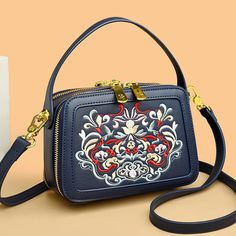 Be unique with this special collection. Elevate your style with our Fashion Floral Embroidery Handbag from the Elegance Embroidered Collection. Crafted for the discerning woman, this high-quality leather shoulder bag exudes luxury and sophistication. The meticulous floral embroidery adds a touch of elegance, while the compact design ensures practicality without compromising on style. As a versatile small crossbody messenger bag, it seamlessly transitions from day to night, making it an essential accessory for every occasion. Whether you're heading to a business meeting or a social gathering, this designer bag promises to enhance your outfit with its refined charm. Experience the perfect blend of fashion and functionality with this exquisite piece, and let your individuality shine through. Leather Shoulder Bags, Handbag Women, Social Gathering, Crossbody Messenger Bag, Business Meeting, Designer Bag, Small Crossbody, Compact Design, High Quality Leather