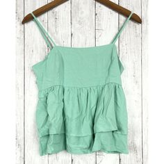 Forever 21 Women S Sage Blue Cami Sleeveless Woven Ruffle Top. Sleeveless Crop Top With Adjustable Straps For Vacation, Spring Cotton Tank Top With Ruffled Straps, Cotton Spaghetti Straps Tank Top With Ruffles, Trendy Ruffled Spaghetti Strap Camisole, Blue Denim Vest For Summer, Spring Crop Top With Spaghetti Straps And Ruffles, Casual Ruffled Camisole Crop Top, Spring Beach Sleeveless Peplum Top, Spring Sleeveless Peplum Top For Beach