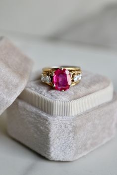 One Retro Ruby and Diamond 18k Yellow Gold Ring. Featuring one cushion cut ruby weighing approximately 2.40 carats. Accented by four round brilliant cut diamonds with a total weight of approximately 0.40 carat, graded H-I color VS clarity. Crafted in 18 karat yellow gold. Circa 1940. The ring is a size 4 3/4 and cannot be resized.About this Item: Step into the mystique of the past with this captivating vintage ruby and diamond ring. Circa 1940, this exquisite piece of jewelry features a cushion Engagement Ring Quiz, Antique Ruby Ring, Colored Stone Engagement Rings, 5 Carat Ring, Yellow Gold Cocktail Ring, Halo Style Engagement Rings, Unique Rings Vintage, Ruby And Diamond Ring, Platinum Diamond Engagement Rings