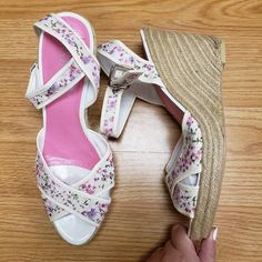 This Pair Of Shoes Is New With Tags. Has Minor Wear From Storage And Has Some Manufacturer Flaws As Shown In The Braided Wedge Of The Heel. Has A Very Dainty And Elegant Floral Pattern On The Straps With White Base. Would Make A Great Shoe To Complement A White Dress. Would Be Good For Bride For Wedding Events Such As Engagement Photos And Rehearsal Dinner. Offers Welcome. Size 10.5 White High Heel Wedge Sandals For Spring, White Closed Toe Wedge Sandals For Spring, White Round Toe Wedge Sandals For Spring, White Wedge Heel Sandals For Spring, White Wedge Sandals For Spring, White Wedge Sandals With Branded Insole, White Wedge Sandals With Ankle Strap, Medium Width, White Ankle Strap Wedge Sandals With Medium Width, White Wedge Sandals With 4-inch Heel For Spring