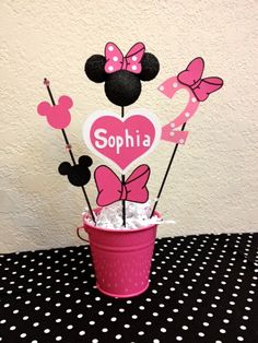 minnie mouse centerpieces in a bucket with polka dots