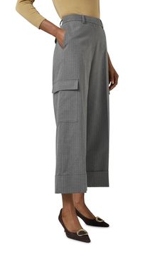 A relaxed take on the utility trend, these cropped pants feature a pinstrope pattern and roomy cargo pockets. Zip fly with button closure Front slant pockets; back flap-patch pockets; cargo flap-patch pockets 65% polyester, 33% viscose, 2% elastane Machine wash, dry flat Imported Cropped Wide Leg Pants With Patch Pockets For Work, Pinstripe Wide-leg Pants With Pockets, Pinstripe Wide Leg Pants With Pockets, Workwear Bottoms With Multiple Pockets For Spring, Spring Workwear Bottoms With Multiple Pockets, Fall Striped Bottoms With Pockets, Bottoms With Multiple Pockets For Work, Spring, Striped Bottoms With Pockets For Fall, Cropped Wide Leg Pants With Side Pockets For Work