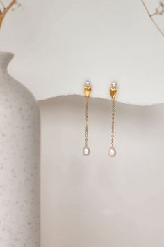 The Aimee Pearl Earrings are meticulously handcrafted using freshwater drop pearls paired with 14k gold-filled components, holding a unique and playful appeal.  Packaged in an elegant plastic-free reusable jewelry box, they make the perfect gift or special treat for oneself. *14k Gold-filled components *Freshwater drop pearls *Hypoallergenic, suitable for even the most sensitive skin *Delivered in a 100% silk jewelry pouchette inside a gift box *Sustainable magnetic closure jewelry box and custo Pearl White Long Drop Earrings As Gift, Pearl White Long Drop Pearl Earrings For Gift, 14k Gold Filled Pearl Earrings For Gifting, Pearl White Long Drop Pearl Earrings As Gift, Elegant Long Drop Pearl Earrings As Gift, Elegant Long Drop Pearl Earrings For Gift, Gold Pearl Drop Earrings As Gift, Gold Plated Teardrop Pearl Earrings For Gift, Gold Pearl Drop Earrings For Gift