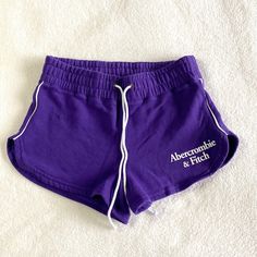 New Without Tag Color: Purple Comfy Shorts In Our Softaf Fleece Fabric, With Drawstring Waist, Embroidered Logo Detail And Side Vents. Imported. Body:60% Cotton, 40% Polyester Fitted Cotton Athletic Shorts For Spring, Fitted Cotton Athletic Shorts For Summer, Purple Sporty Cotton Bottoms, Purple Cotton Shorts With Elastic Waistband, Sporty Purple Cotton Bottoms, Summer Cotton Workout Shorts, Trendy Cotton Workout Shorts, Purple Cotton Pajama Shorts For Summer, Summer Workout Cotton Shorts