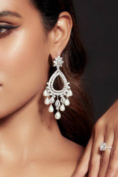 Rhodium plated tear drop carved cutwork earrings with crystal embellishment. - Aza Fashions Diana Penty, Luxury Sale, Kiara Advani, Jewellery Earrings, Fashion App, Silver Crystal, Crystal Embellishment, Cut Work, Modern Bride