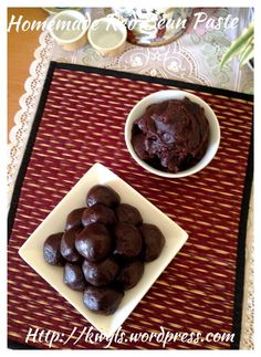 two bowls filled with chocolate covered cookies on top of a red and white place mat