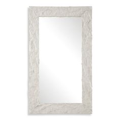 a white frame mirror on a wall