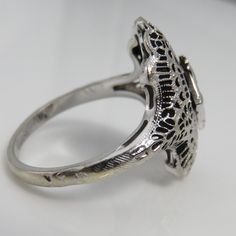 Art deco 14k white gold. estate 1920's diamond ring. size 6.75. quality clean 5pt diamond . great shape. mark 14k. 2.9grams. 2omm long. Victorian 14k Gold Cluster Ring For Anniversary, Antique Platinum Cluster Ring, Estate Style Round Jewelry Gift, Victorian Engraved Oval Diamond Ring, Victorian Oval Engraved Diamond Ring, Victorian Style Engraved Oval Diamond Ring, Estate Silver Diamond Ring With Diamond Cut, Estate Style Silver Diamond Ring With Diamond Cut, Estate White Gold Diamond Cut Rings