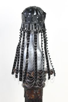 This headpiece is inspired by the female hats of the old Mongolian Ordo tribe. The married woman, and especially the mother of the male children, was very appreciative and wealthy. While the husbands were hunting, fighting and property enlargement, Ordo's wife was the head of the house as the chief administrator of the entire property. They wore luxurious caps of felt or leather with a plenty of corals and turquoise sewn on it. A lot of silver parts and swabs on the front and back were sewn on l Ceremonial Headpiece With Tall Crown, Adjustable Tall Crown Headpiece For Ceremonial Occasions, Unique Festival Headpiece With Tall Crown, Unique Tall Crown Headpiece For Festival, Evening Headpiece With Tall Crown, Ceremonial Black Adjustable Headpieces, Adjustable Black Ceremonial Headpiece, Traditional Round Crown Headpiece For Party, Unique Structured Crown Headpieces For Party