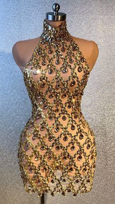 Glamorous Embellished Bodycon Party Dress, Fitted Embellished Backless Dress For Night Out, Embellished Backless Dress For Night Out Party Season, Elegant Dresses For Glamorous Party Season Events, Elegant Dresses For Party Season And Glamorous Events, Sleeveless Dress For Glamorous Events, Glamorous Fitted Embellished Backless Dress, Glamorous Gold Mini Dress For Evening, Glamorous Fitted Backless Party Dress