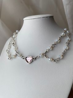 Made with silver plated copper wire, plastic duo chrome beads, pewter and crystal heart link, stainless steel jump rings, and silver plated closure. 13" length, 3" extender. Sizing available please refer to personalization field.  Thank you so much for supporting my small business! Every purchase means so much to me. Check out my instagram @ReganAnne.Apparel to keep up with new releases. Light Pink Crystal, Heart Choker Necklace, Heart Choker, Silver Lights, Crystal Heart, Pink Crystal, Jump Rings, Copper Wire, Silver Plate