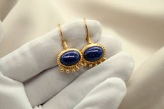 METAL: 925k Silver GEM:  lapis lazuli Stone Size: approx 10x14mm  COATING: 24k gold over (We can made a special type of coating for your personal preference ) MATERIEL : 925K Sterling Silver ( Some of my items vermeil gold over silver for looks rich . But i can finish in silver too ) SHIPPING PRICE AND DURATION: We are shipping worlwide. Your products are sent within 2 business days after the order. 1-3 working days to Europe United States 6-10 working days other countries and continents arrive Gold Lapis Lazuli Gemstone Earrings, Elegant Gold Lapis Lazuli Earrings, Gold Oval Lapis Lazuli Jewelry, Oval Gold Lapis Lazuli Jewelry, Gold Lapis Lazuli Earrings As Gift, Gold Lapis Lazuli Earrings For Gift, Lapis Lazuli Jewelry, Lapis Lazuli Earrings, How To Look Rich