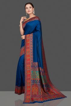 Gorgeous blue multiprint silk saree is a stunning choice for festivals and pre-wedding occasions! It is enhanced with Kani embroidery and comes with a pink blouse piece. Shop silk sarees in USA from Pure Elegance. The shown stitched blouse on the model is for display purpose only. The saree comes with a matching blouse piece and finished with fall and piko. Disclaimer: The actual product may vary slightly from the image. These are custom orders, hence expect slight variation in color, placement Blue Jamawar Pre-draped Saree With Zari Weaving, Blue Silk Traditional Wear With Printed Border, Blue Banarasi Silk Traditional Wear With Printed Border, Blue Saree With Printed Border For Festivals, Blue Tussar Silk Bollywood Salwar Kameez, Blue Unstitched Katan Silk Saree, Blue Katan Silk Dupatta With Printed Border, Blue Dola Silk Saree With Traditional Drape, Blue Dola Silk Saree In Traditional Drape