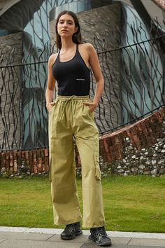 This pant is ready to ignite. The Trouser Pant in soft cotton features a roomy, wide leg fit with cargo pocket detailing, side pockets and a elastic waistband with drawstring. Pair it up with a matching jacket or wear on its own with fave kicks. Green Cargo Style Wide-leg Parachute Pants, Green Cargo Wide Leg Pants For Spring, Green Wide Leg Pants With Cargo Pockets For Spring, Cargo Style Pants For Loungewear, Relaxed Fit Wide Leg Lounge Pants With Cargo Pockets, Green Cotton Cargo Wide Leg Pants, Green Cotton Cargo Style Wide Leg Pants, Green Cotton Wide Leg Pants With Cargo Pockets, Spring Green Wide Leg Cargo Pants