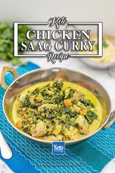 chicken saag curry recipe in a silver bowl on a blue place mat with spoons