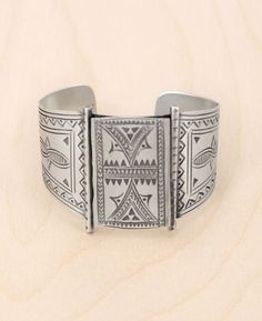 Evoke an aura of mystery and allure with our Hilltribe Silver Wide Cuff Bracelet. Crafted with love from the majestic hills, this piece tells a story of age-old traditions and artisanal mastery. Every etching is a testament to the intricate skills of the hill tribes, beautifully showcased on all sides of this luminous bracelet. Durable yet exquisitely chic, this bracelet is not just jewelry – it's a conversation starter, an heirloom, and a piece of art. Material: Sterling Silver Authentic Hilltr Artisan Bangle Jewelry For Festivals, Unique Adjustable Ceremonial Bracelets, Unique Ceremonial Adjustable Bracelet, Unique Adjustable Bracelets For Ceremonial Occasions, Bohemian Stamped Cuff Jewelry, Artisan Oxidized Adjustable Jewelry, Artisan Oxidized Bangle Jewelry, Artisan Adjustable Cuff Bracelet With Intricate Design, Artisan Bangle Cuff Bracelet For Festivals