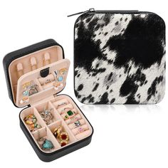 a black and white animal print case with jewelry in it