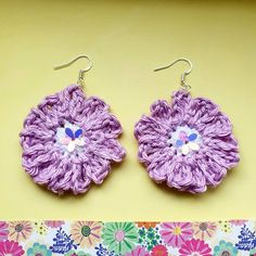 🦋 Pretty floral Earrings  💜 Hand crochet by me  🧡 Each flower measures approx 4cm round  💕 Finished off with a beautiful irredecent bead 🌻 Attached to sterling silver earring hooks - hypoallergenic  🌼 💜 Thank you for looking at my handmade creations - if you would like a personalised item please drop me a message -  would love to hear from you!  🌈 Have a lovely day! Bohemian Beaded Flower Earrings, Handmade Silver Flower Beaded Earrings, Handmade Silver Beaded Flower Earrings, Lilac Crochet, Earring Hooks, Floral Earrings, Silver Earring, Hand Crochet, Sterling Silver Earrings