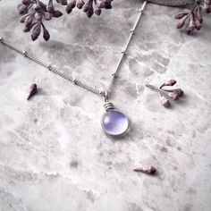 "Light Purple Raindrop Necklace for Women Boho Jewelry, Sterling Silver Cottagecore Necklace, Simple Minimalist Dainty Necklace, Gift for Her 🌦️Our Spring Rain Drop Necklace is made with sterling silver. The silver brightens this beautifully simple design. This Earthy Necklace is the perfect gift for a nature lover. They will love this simple Aesthetic Necklace and bright sterling glass pendant with a beautiful cottagecore jewelry. 🌞The dainty necklace is a great for everyday wear. Glass reall Dainty Round Pendant Crystal Necklace For Everyday, Dainty Crystal Necklace With Round Pendant For Everyday, Minimalist Moonstone Necklace With Delicate Chain, Dainty Everyday Crystal Necklaces With Round Pendant, Dainty Everyday Crystal Necklace With Round Pendant, Delicate Silver Crystal Necklaces For Everyday, Everyday Moonstone Necklaces, Delicate Silver Crystal Necklace For Everyday, Minimalist Hypoallergenic Teardrop Pendant Necklace