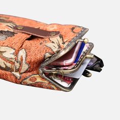 With a nod to the Victorian era, MCW’s freshly combines the classic and elegant design of the traditional carpet bag with a textural and tactile twist.The main body of the functional phone case is made with rich chenille carpet, cotton floral canvas, and brass clasp with double kiss lock. With the width 4.15" and height 8.60" it can easily hold phones of any sizes (max phone width to 4"), with the leather wrist strap that comes with the bag. There are two mini rings at both sides of the clasp and it will come with a 60" detachable chain with hooks so this bag could be switched to crossbody.Both exterior and inside divider are padded with 100% cotton canvas, providing complete protection for the stuffs. This Victorian Carpet Case is designed to hold cell phone, passport, cards, reading glas Vintage Brown Phone Bag With Cell Phone Pocket, Vintage Phone Bag With Removable Pouch For Travel, Vintage Travel Phone Bag With Removable Pouch, Vintage Wallet With Removable Pouch For Travel, Vintage Rectangular Phone Bag With Removable Pouch, Vintage Phone Bag With Removable Pouch, Vintage Phone Bag With Cell Phone Pocket For Travel, Vintage Phone Bag For Travel, Vintage Travel Phone Bag With Cell Phone Pocket