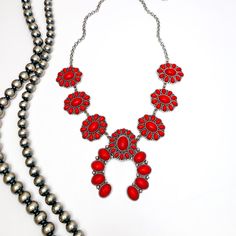 The Western Way Squash Blossom Necklace in Red. Pictured on a white background with Navajo beads on the left. Southwestern Style Red Necklace For Gift, Western Style Red Jewelry As Gift, Southwestern Necklaces For Western-themed Events, Red Southwestern Necklace With Adjustable Fit, Adjustable Southwestern Red Necklace, Southwestern Style Adjustable Red Necklace, Giddy Up Glamour, Squash Blossom Necklace, Squash Blossom