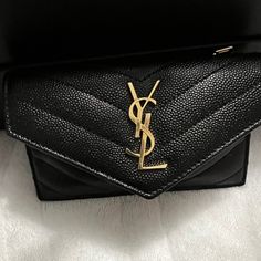 Like New Condition Small Wallet Chic Black Envelope Wallet, Designer Black Envelope Clutch, Ysl Small Envelope, Luxury Black Envelope Clutch, Black Ysl Wallet, Designer Black Wallet With Gold-tone Hardware, Luxury Black Wallets With Gold-tone Hardware, Envelope Wallet, Black Wallets With Zipper Closure For On-the-go