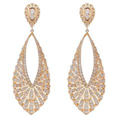 A teardrop design have a timeless, elegant appeal that is highly versatile and suitable for a wide range of occasions. This 18k Rose Gold diamond drop earrings have an elegant, slender vintage look to them. Each teardrop shaped dangle shimmers with a total of 4.45 carat diamonds in an intricate pave design. The dangling drop frames are linked to a pear shape featuring 2 round diamonds and a surrounding pave. Polished to a bright shine, these stylish earrings secure with push backs. Luxury Rose Gold Pear-shaped Earrings, Diamond Dangling Earrings, Art Deco Drop Earrings, Gold Diamond Drop Earrings, Wedding Earrings Studs, Teardrop Diamond, Wedding Studs, Cad Cam, Turquoise Drop Earrings