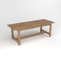 a wooden table sitting on top of a white floor