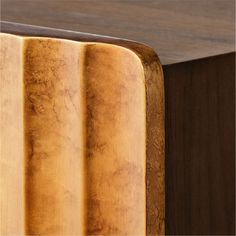 a close up view of a wooden table with wood grained edges and an interesting design