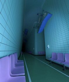 there are four purple chairs in the room with blue tiles on the walls and floor