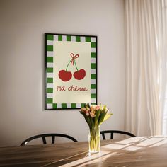 a vase with flowers sitting on top of a wooden table in front of a painting