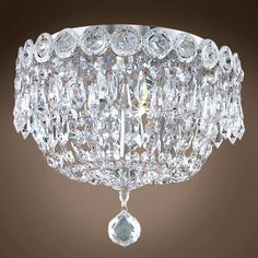 a crystal chandelier hanging from the ceiling