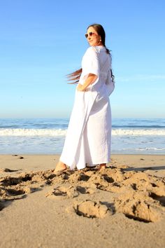 Enjoying summer's simple pleasures is easy when your go-to garment is an elegant 'n ethereal, long 'n lovely, flowing caftan!! Make that caftan a 100% pure linen one, and you've set the perfect mood for summer lounging!! A luxurious white linen maxi dress is just the thing for a cruise, a beach getaway, or summer hostessing!! Medium weight fabric; 100% linen. Subtle side slits from the knee down, keep movement in this caftan easy and the fabric flowing. -Fit-------------------------------------- White Relaxed Fit Long Maxi Dress, White Tunic Style Relaxed Fit Maxi Dress, White Relaxed Fit Tunic Maxi Dress, Long Linen Beach Dress, White Linen Maxi Dress For Beach, White Linen Maxi Dress For The Beach, White Maxi Linen Dress For Beach, White Linen Maxi Dress, Tropical Outfit