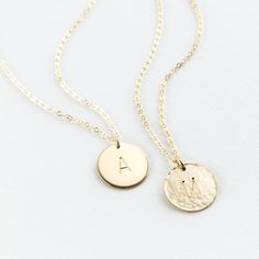 "This pendant necklace is a classic--and for good reason. Add a special initial or symbol (or leave it blank!) and wear every day, with everything. Every piece is handcrafted and hand-personalized with love in La Conner, WA, using 90% recycled and 100% ethically sourced raw materials from the USA--because it's better that way. Includes free gift-ready packaging (featuring a care card and traditional letterpress goodies made by my dad)!  MATERIALS: * Gold = 14k gold filled * Silver = sterling silver * Rose gold = 14k rose gold filled DETAILS: * 13mm disk * Hand-personalized with traditional metal punches AT CHECKOUT: * If you chose \"other\" for length, specify which length you'd like in a note. * Select expedited shipping (and add a note with your ideal delivery date) if you need your piec Classic Rose Gold Initial Pendant Name Necklace, Classic 14k Gold Initial Charm Necklaces, Classic 14k Stamped Initial Pendant Jewelry, Classic 14k Gold Initials Charm Necklace, Classic Round 14k Gold Name Necklace, Classic Initial Pendant Charm Necklace For Anniversary, Classic Initial Necklace As A Gift, Classic Necklaces With Initial Pendant For Anniversary, Classic Initial Pendant Necklace For Mother's Day